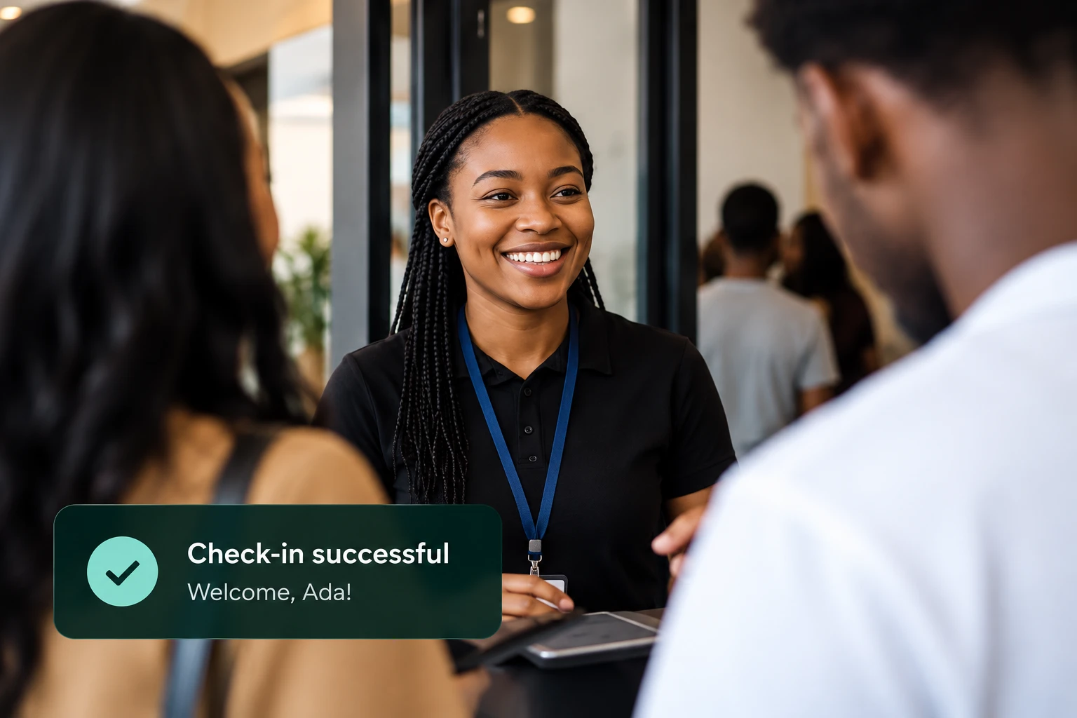 A team member welcomes guests as a Rally check-in confirmation appears on screen